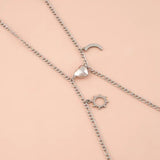 Coppia di bracciali in acciaio con ciondolo